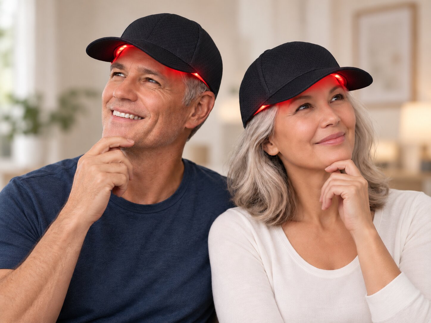 Older couple in plain black laser caps considering their hair-growth routine